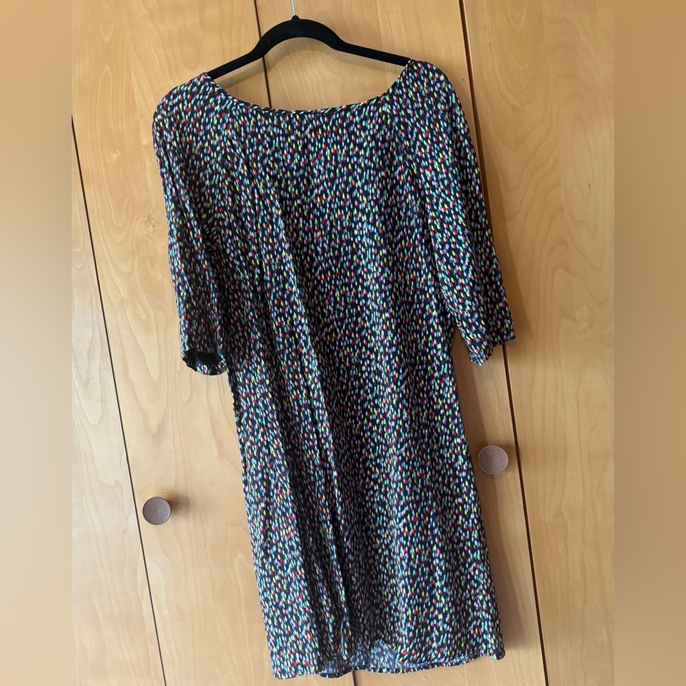 Promod Cute little multi-colored dress fully lined with a tie at the back. NWT